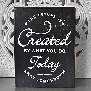 Plåtskylt The future is created by what you do